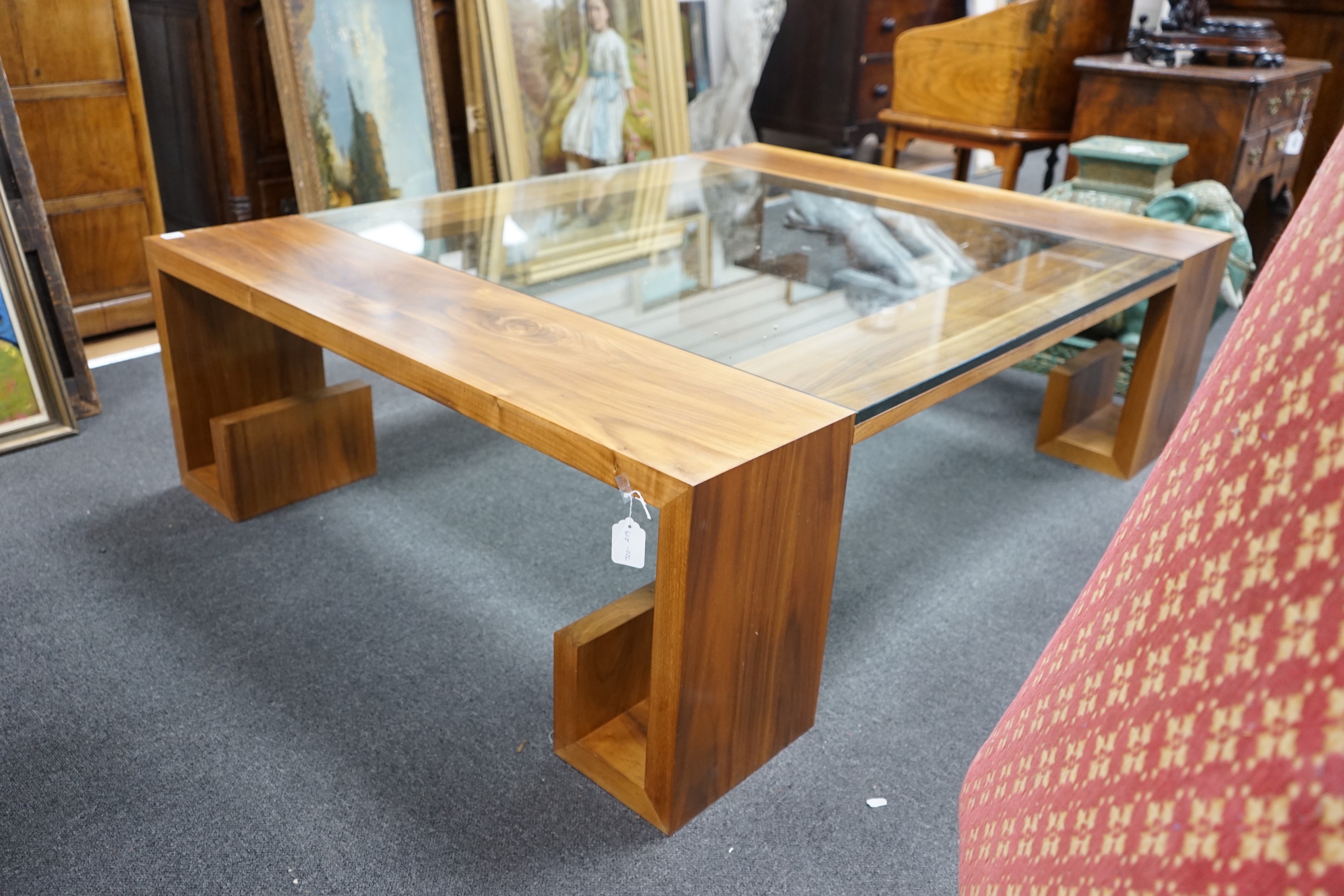 A contemporary hardwood and plate glass coffee table, length 160cm, depth 120cm, height 45cm